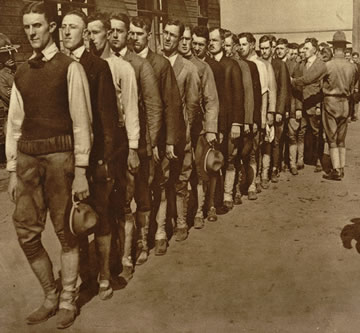 Men standing in line according to height