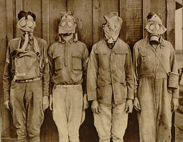 soldiers wearing various types of gas masks