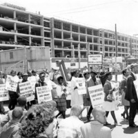NAACP members protesting at a construction site.